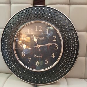 Westminister wall clock 16in 16in. Black and gold color